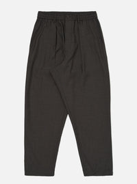 A pair of Brown Marl Tropical Suiting Pleated Track Pants is displayed flat against a plain white background. The trousers feature a loose, tapered fit with a drawstring waistband and prominent pleats at the front.