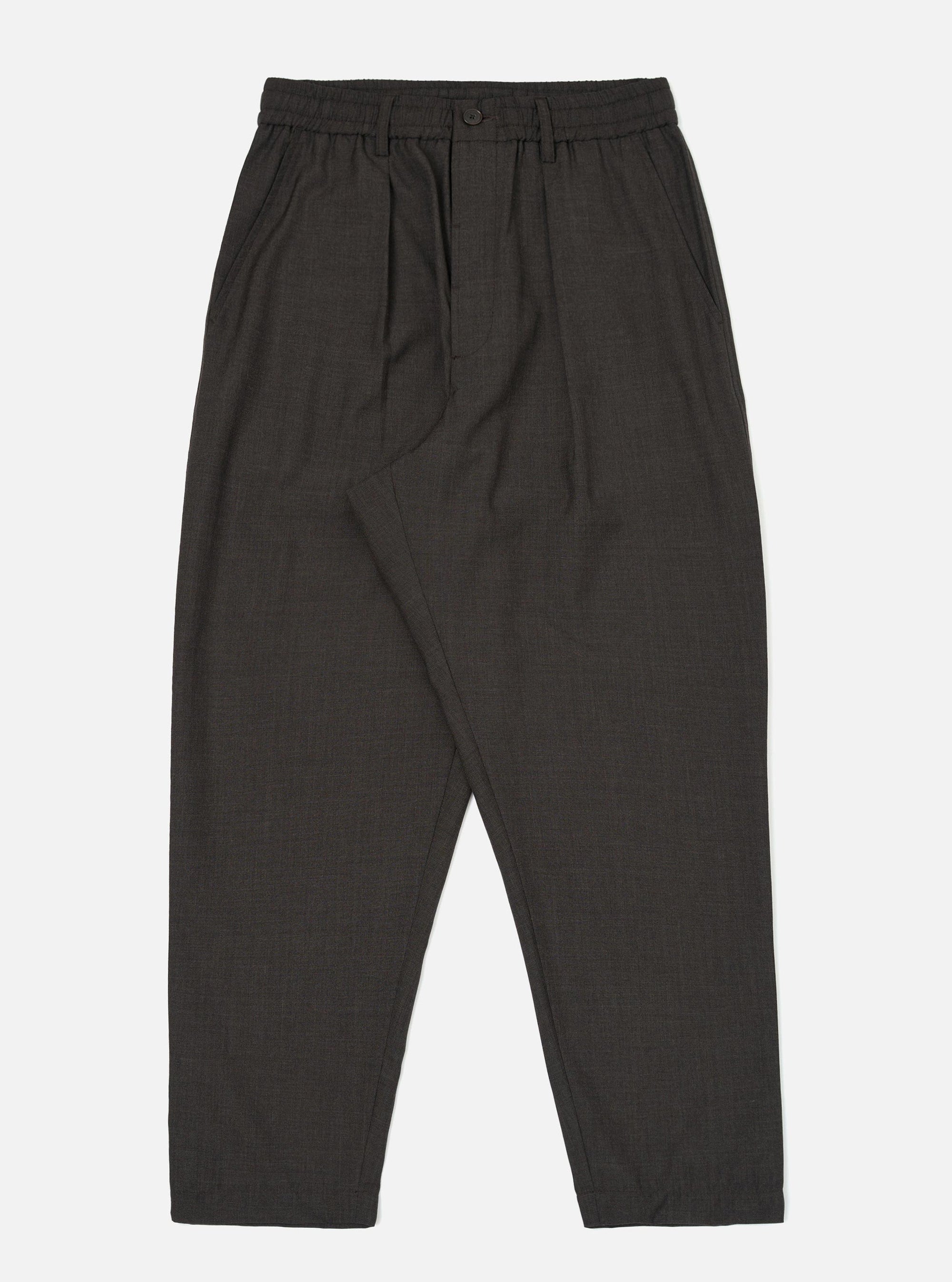 A pair of Brown Marl Tropical Suiting Pleated Track Pants is displayed flat against a plain white background. The trousers feature a loose, tapered fit with a drawstring waistband and prominent pleats at the front.
