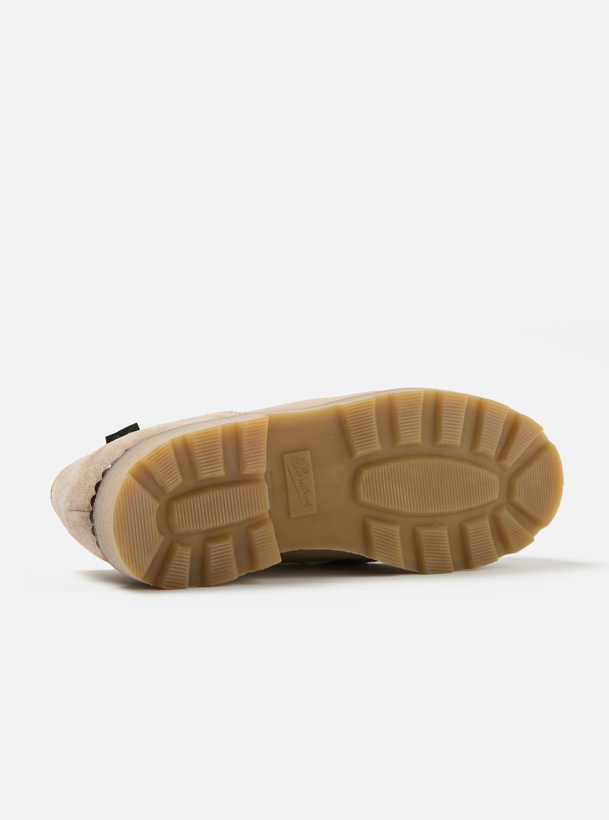 Close-up of the sole of the Paraboot x Universal Works Michael in Sand Leather/Suede shoe on a white background. The sole is a lugged rubber with the Paraboot logo.