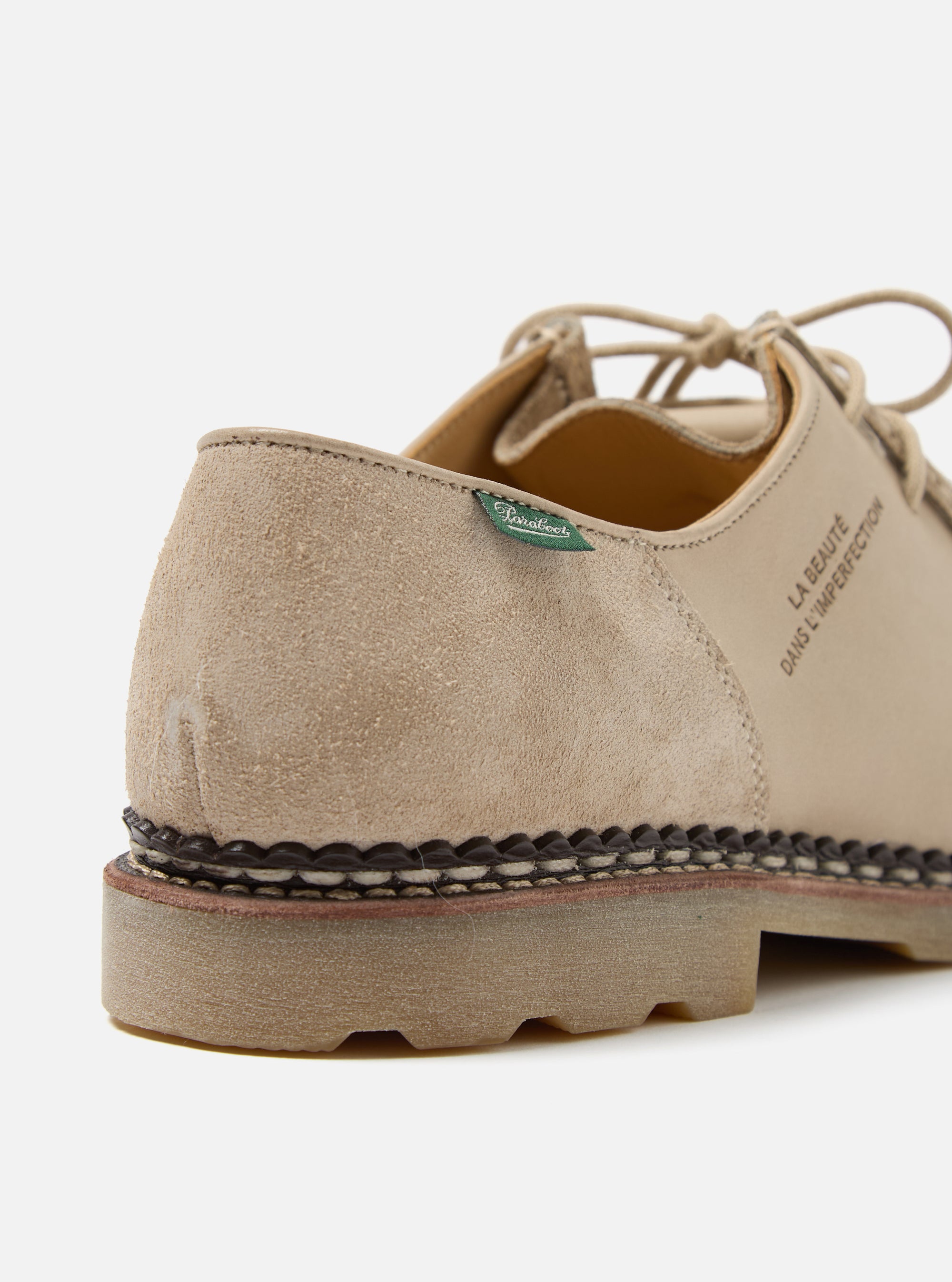 Close-up of the Paraboot x Universal Works Michael in Sand Leather/Suede. The shoe features a sand-colored leather and suede upper, a dark brown welt, and a light brown sole. Shot on a white background.