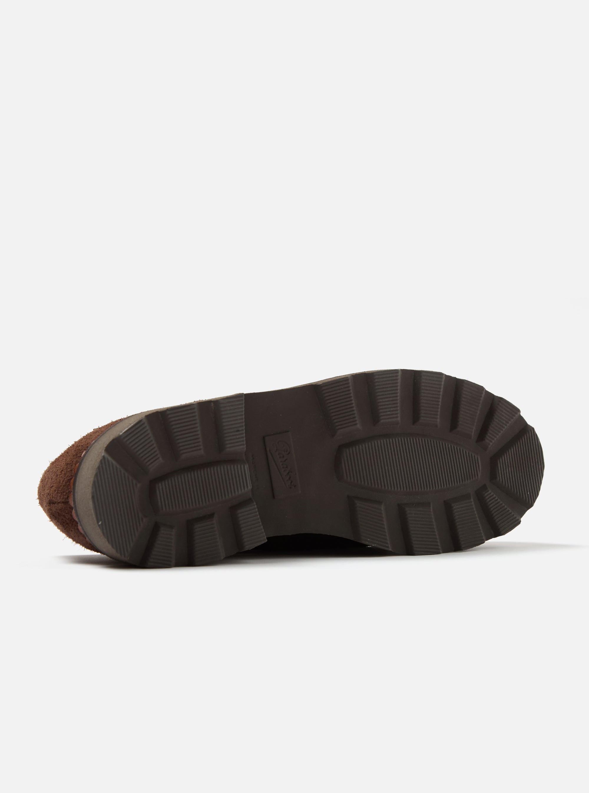 Close-up of the sole of the Paraboot x Universal Works Michael in Coffee Leather/Suede shoe on a white background, showcasing its lugged design and construction.