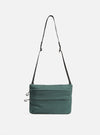The F/CE.® Green Nylon 2.5 Layer Sacoche, a green nylon bag with a black strap, is centered on a white background. The bag has a rectangular shape with horizontal stitched lines.