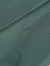 Close-up of the F/CE.® Green Nylon 2.5 Layer Sacoche showing the fabric texture and embroidered logo. The background is a simple, neutral surface.