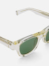 Close-up of A. SOCIETY x Universal Works Honey Stanley Sunglasses. Frames are clear with a honey tint, lenses are green. Shot on a white background.