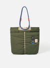 Topologie x Universal Works Rifle Green UW Tech Helmet Bag on a white background. The bag is green with blue rope handles and patches.