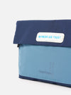 Close-up of the Topologie x Universal Works Insignia Blue UW Tech Musette Medium. Features two-tone blue nylon, white logo patch, and subtle branding on a clean white background.