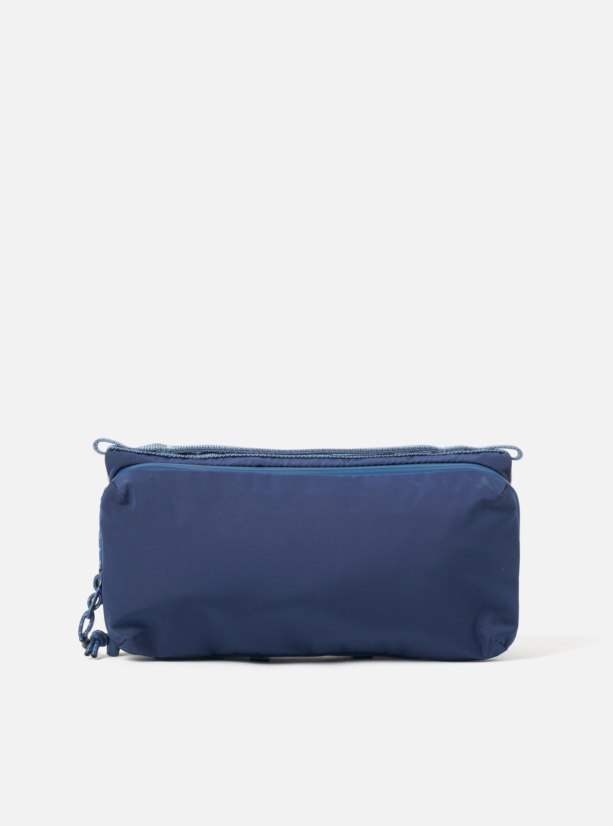 The Topologie x Universal Works Insignia Blue UW Tech Bottle Sacoche Medium. A dark blue bag with blue rope detailing, on a white background. 