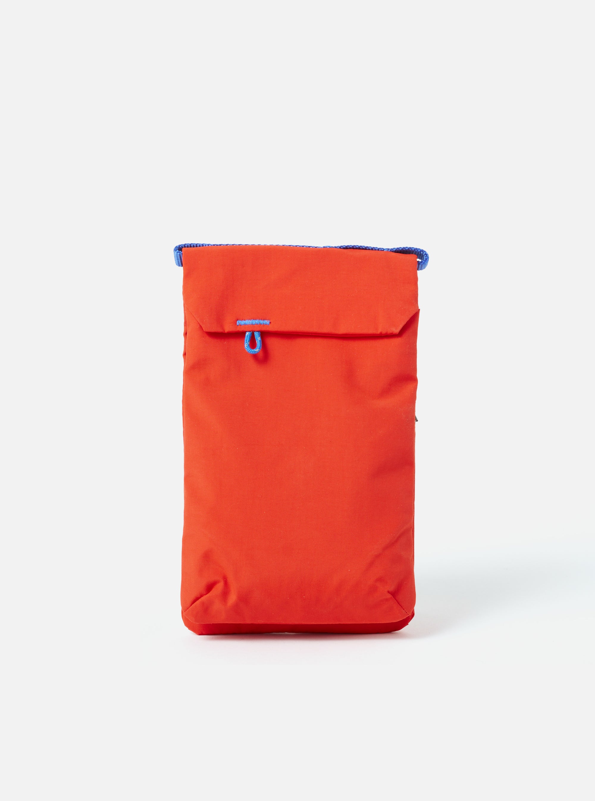 The Topologie x Universal Works Red UW Tech Phone Sacoche, a vibrant red bag with blue accents, is centered on a clean white background. The material appears durable and slightly textured.