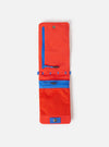 Flat lay of the Topologie x Universal Works Red UW Tech Phone Sacoche on a white background. The sacoche is red with blue zipper and details, featuring a mesh pocket.