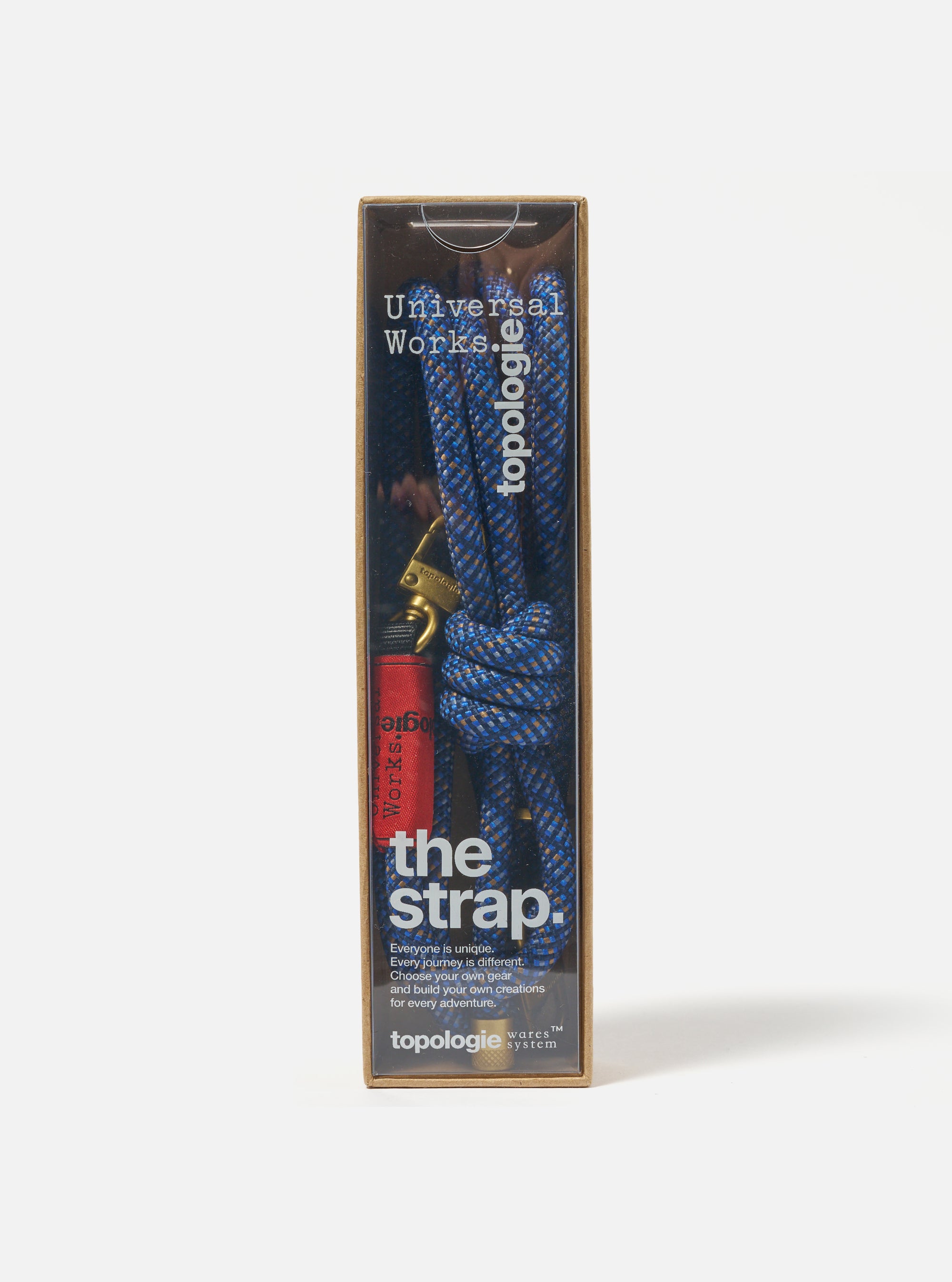 Topologie x Universal Works Navy Hitch UW Rope 8mm Rope Strap in its packaging. The rope is blue and brown. Shot on a white background.