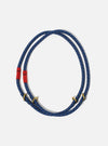 The Topologie x Universal Works Navy Hitch UW Rope 10mm Rope Loop on a white background. The rope is blue with gold accents and red fabric. 