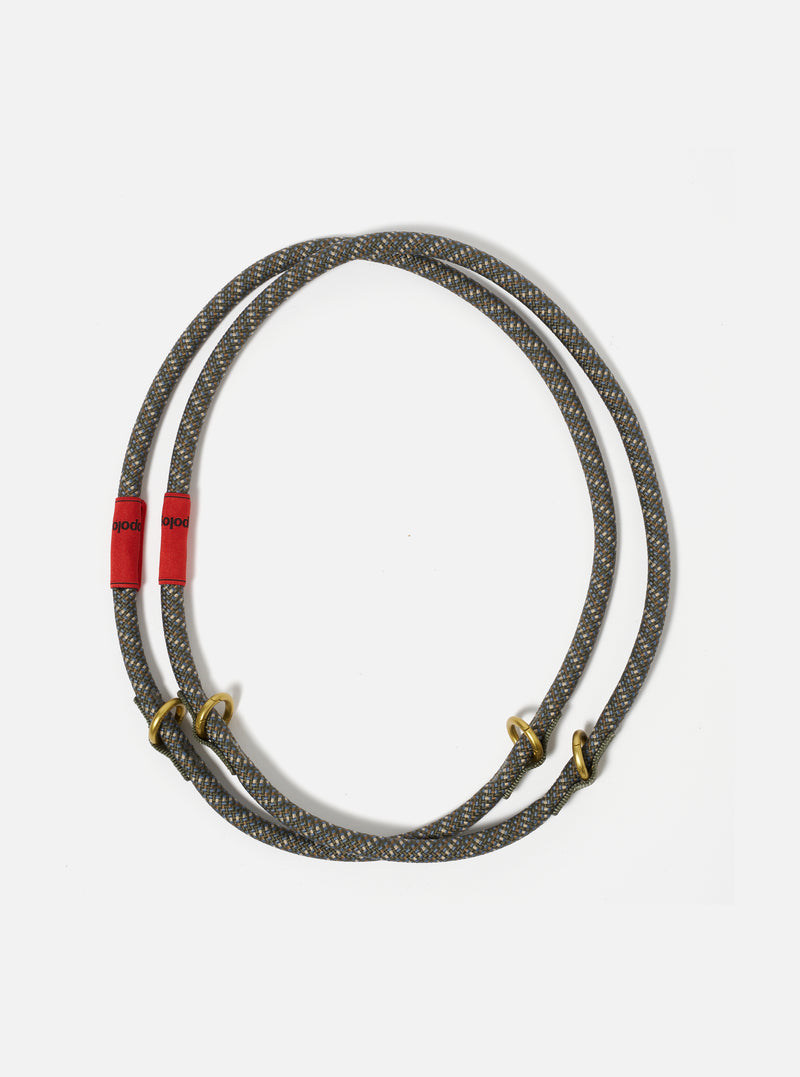 Topologie x Universal Works Olive Hitch UW Rope 10mm Rope Loop on a white background. The rope is olive with blue and tan accents and has red fabric and gold metal details.