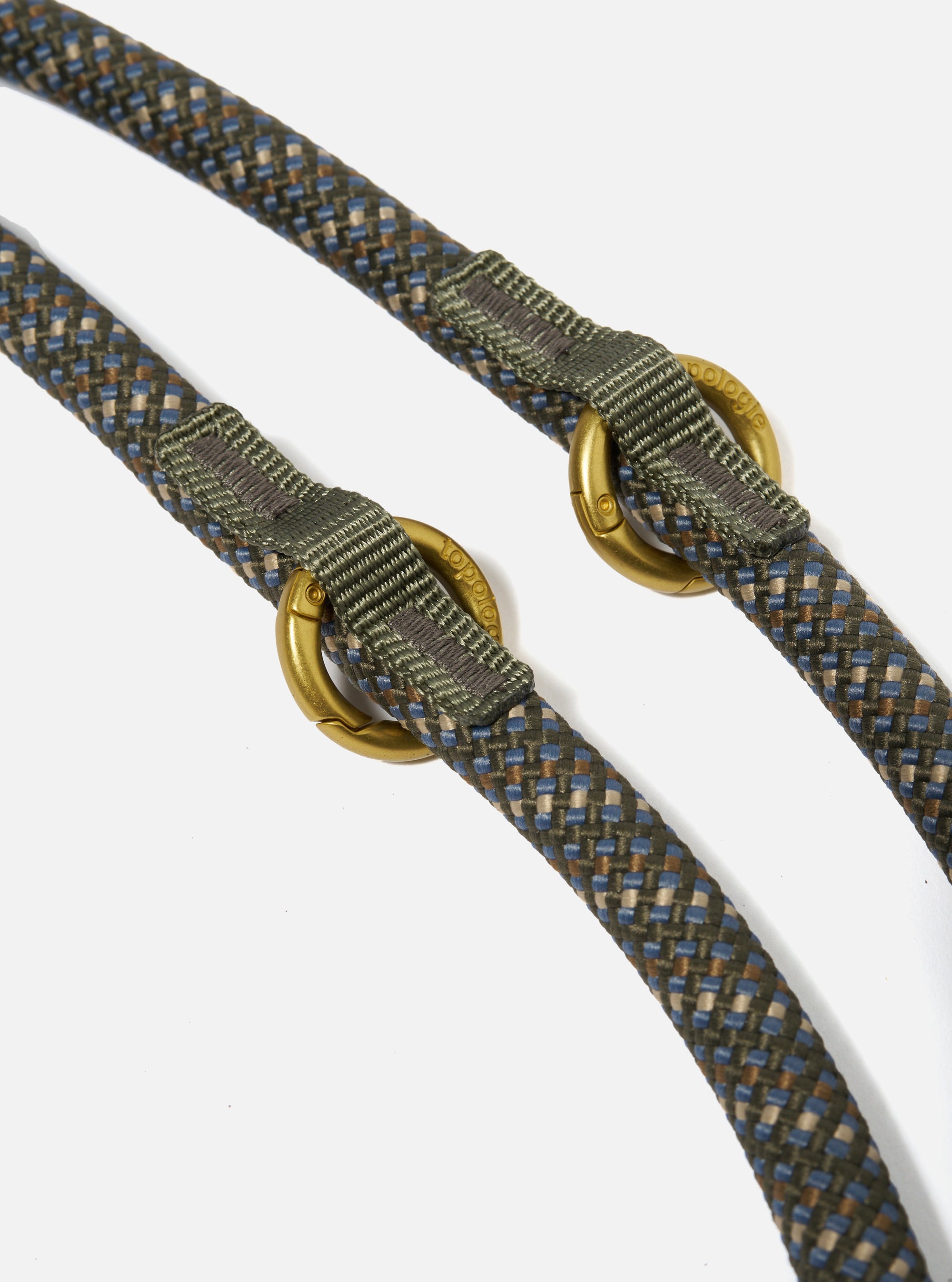 Close-up of the Topologie x Universal Works Olive Hitch UW Rope 10mm Rope Loop on a white background. The rope is olive with blue and brown accents and has gold metal hardware.