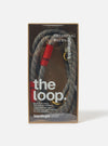 Close-up of the Topologie x Universal Works Olive Hitch UW Rope 10mm Rope Loop in its packaging. The rope is olive with blue accents and red fabric. Shot on a white background.