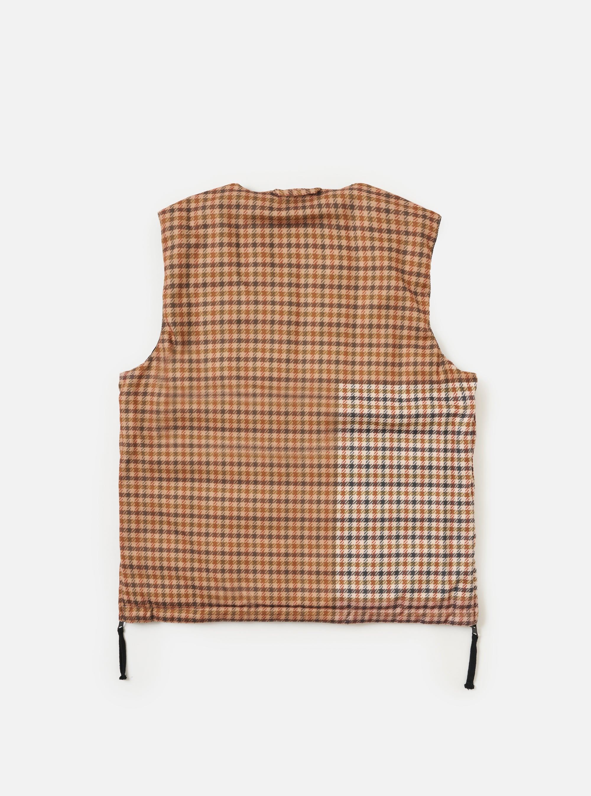 Flat lay of the TAION x Universal Works Reversible Black Military Line Vest. The vest is brown plaid with black drawstrings on a white background.
