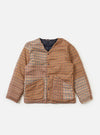 The TAION x Universal Works Reversible Dark Navy Military Line Liner Jacket is laid flat on a white background. It features a brown and tan houndstooth pattern with a navy lining.
