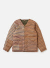 The TAION x Universal Works Reversible Dark Olive Military Line Liner Jacket on a white background. The jacket is brown plaid with an olive green lining.