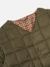 Close-up of the TAION x Universal Works Reversible Dark Olive Military Line Liner Jacket on a white background. Shows the olive quilted material and the brown houndstooth reversible side.