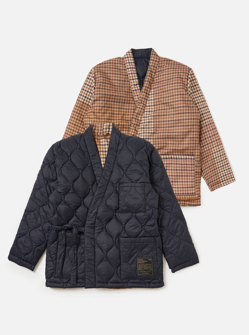 Two TAION x Universal Works Reversible Kyoto Work Jackets on a white background. One is dark navy quilted, the other is brown plaid. Both have a relaxed fit.