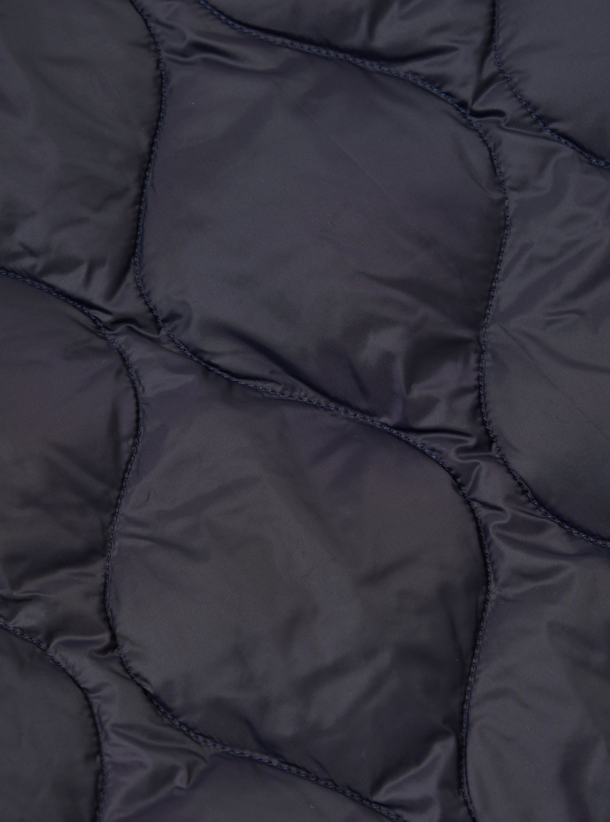 Close-up of the TAION x Universal Works Reversible Dark Navy Military Line Kyoto Work Jacket, showing the quilted texture and dark navy color.