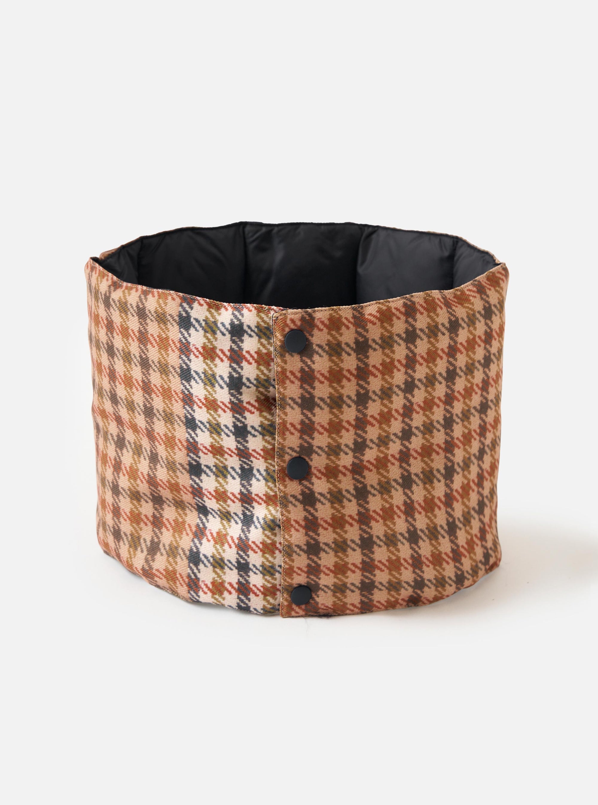 The TAION x Universal Works Reversible Black Military Line Neck Warmer. It features a brown houndstooth pattern on one side and black on the other, with button closures. Shot on a white background.