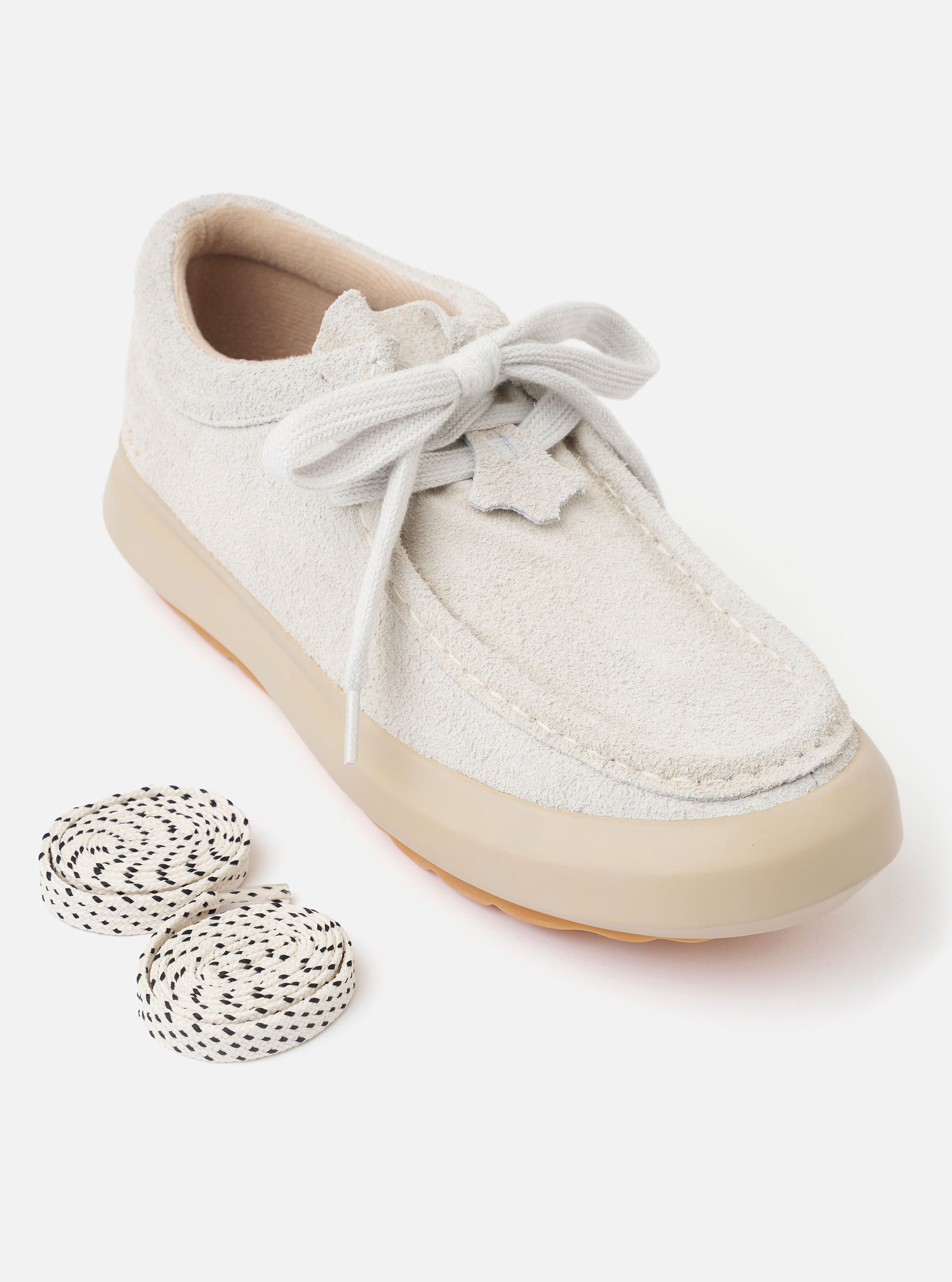 The Wander etc. FD/08 in Papier/Gum Suede/Leather is shown from a rear three-quarter angle as a flat lay against a white background. The image highlights the off-white hairy suede upper, fat cream laces, and the chunky gum rubber outsole. Small black branding is visible on the heel.