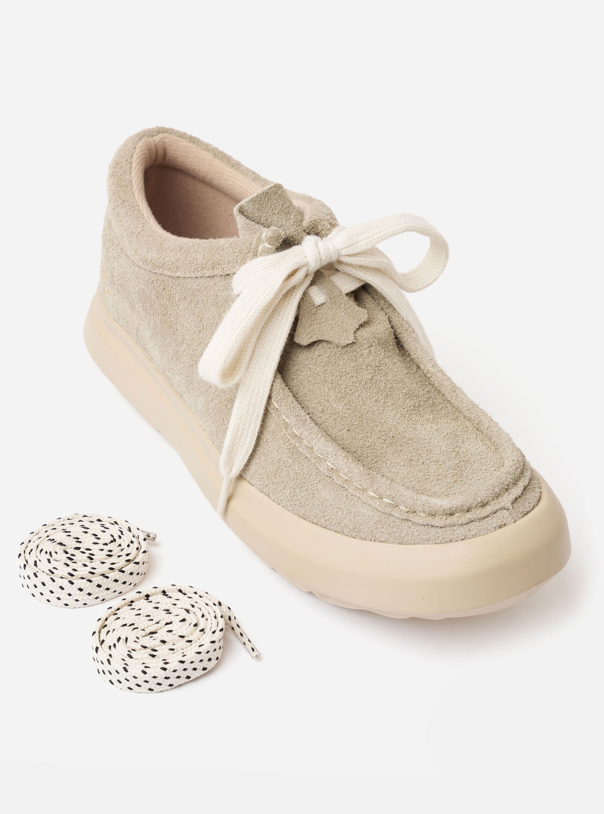 The Wander etc. FD/08 in Dust/Off White Suede/Leather is shown from a rear three-quarter angle as a product shot against a plain white background. The shoe features a textured, hairy suede upper in a dust grey color, contrasted by off-white leather panels and thick, chunky laces. The design is finished with a substantial, cushioned off-white outsole and branding detail on the heel.