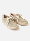 The Wander etc. FD/08 in Dust/Off White Suede/Leather is shown from a rear angle against a plain white background. The shoe features a textured, light dust-colored hairy suede upper and a thick, off-white cushioned outsole. A branded pull tab is visible on the heel, and the chunky laces are tied at the front.