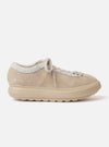 The Wander etc. 'The 70's' in Bone Hairy Suede/Leather is shown from a side profile against a plain white background. The low-top shoe features a textured bone-colored hairy suede upper with tonal laces and a signature chunky off-white sole.