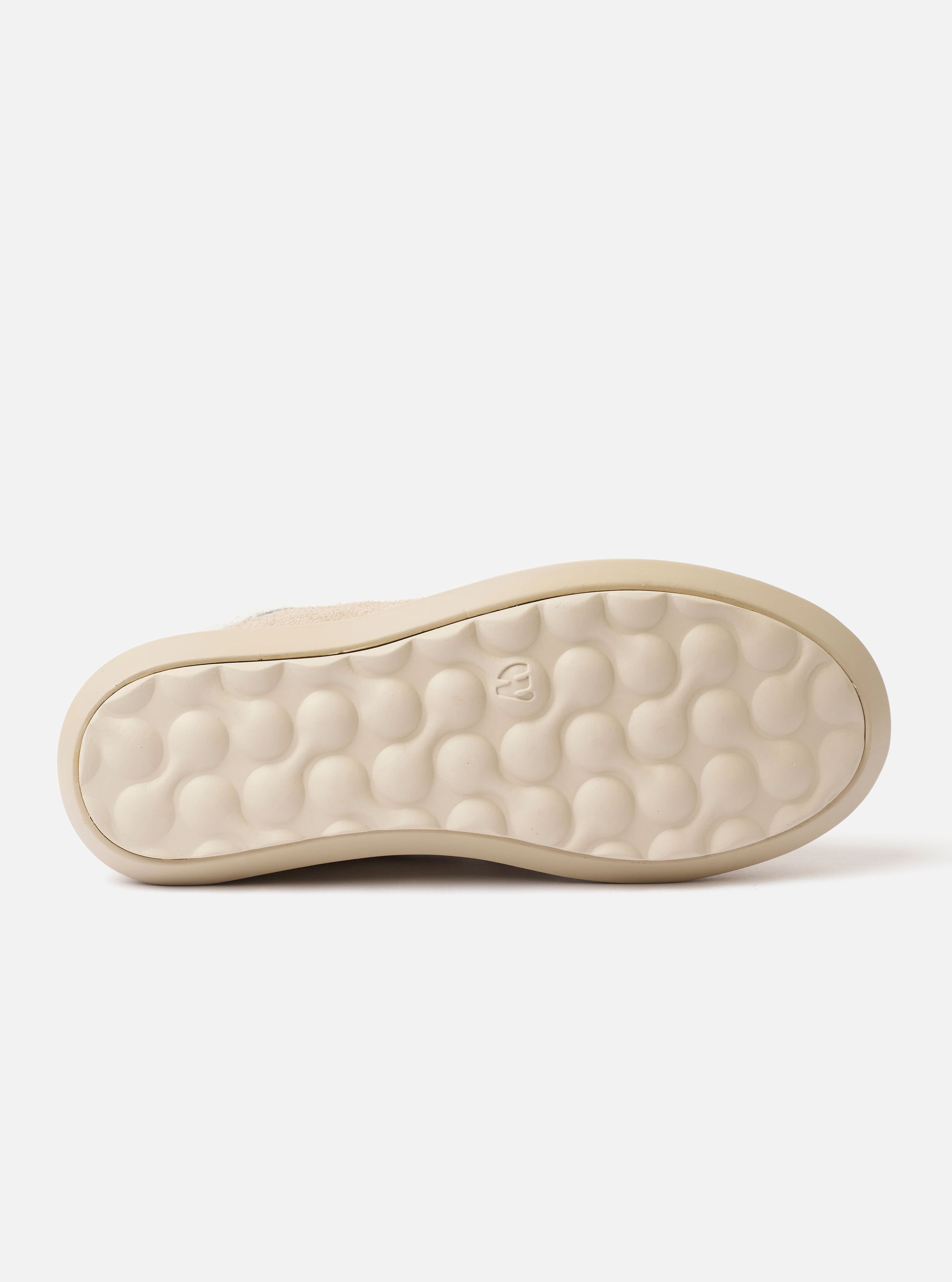 The Wander etc. 'The 70's' in Bone Hairy Suede/Leather is shown as a flat lay against a plain white background. The image provides a detailed view of the shoe, highlighting the textured bone-colored hairy suede upper, the low-cut silhouette, and the clean lines of the leather construction. The tonal phylon and rubber outsole is visible, emphasizing the vintage-inspired aesthetic.