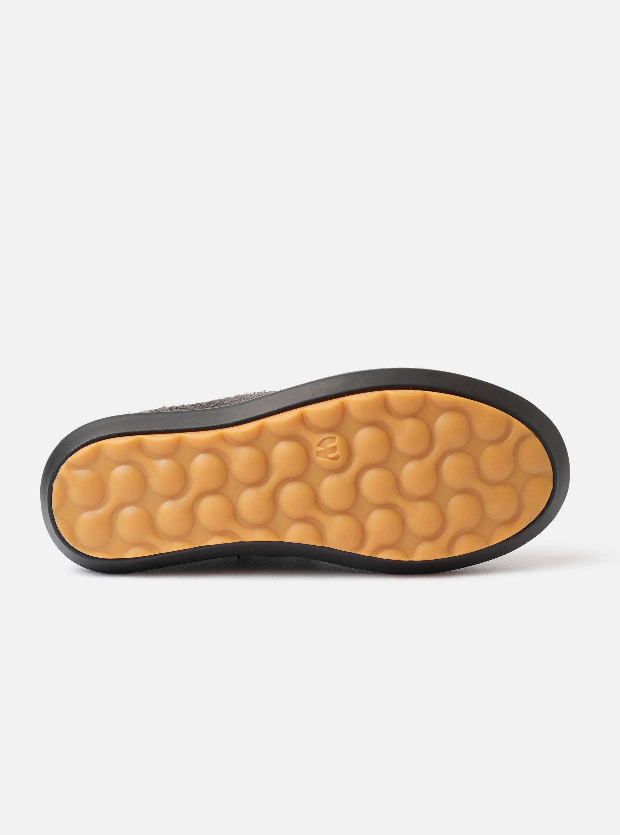 The Wander etc. FD/08 Low in Black Asphalt/Gum Hairy Suede is displayed as a flat lay against a plain white background. The image shows the low-cut shoe from a side profile, highlighting the textured black hairy suede upper and the chunky gum-colored rubber outsole.