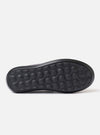 The Wander etc. Laze in Black Nappa Leather is shown as a flat lay against a plain white background. The footwear is a backless mule style featuring a smooth black nappa leather upper and a chunky black phylon and gum outsole. The interior reveals a cork footbed with a printed logo.