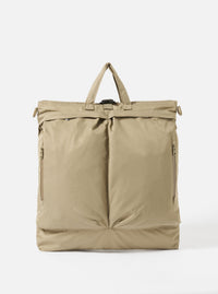 The F/CE.® Sage Green Recycled Twill 3-Way Helmet Bag is displayed on a white background. The bag is sage green and made of recycled twill. It has a top handle and two front pockets.