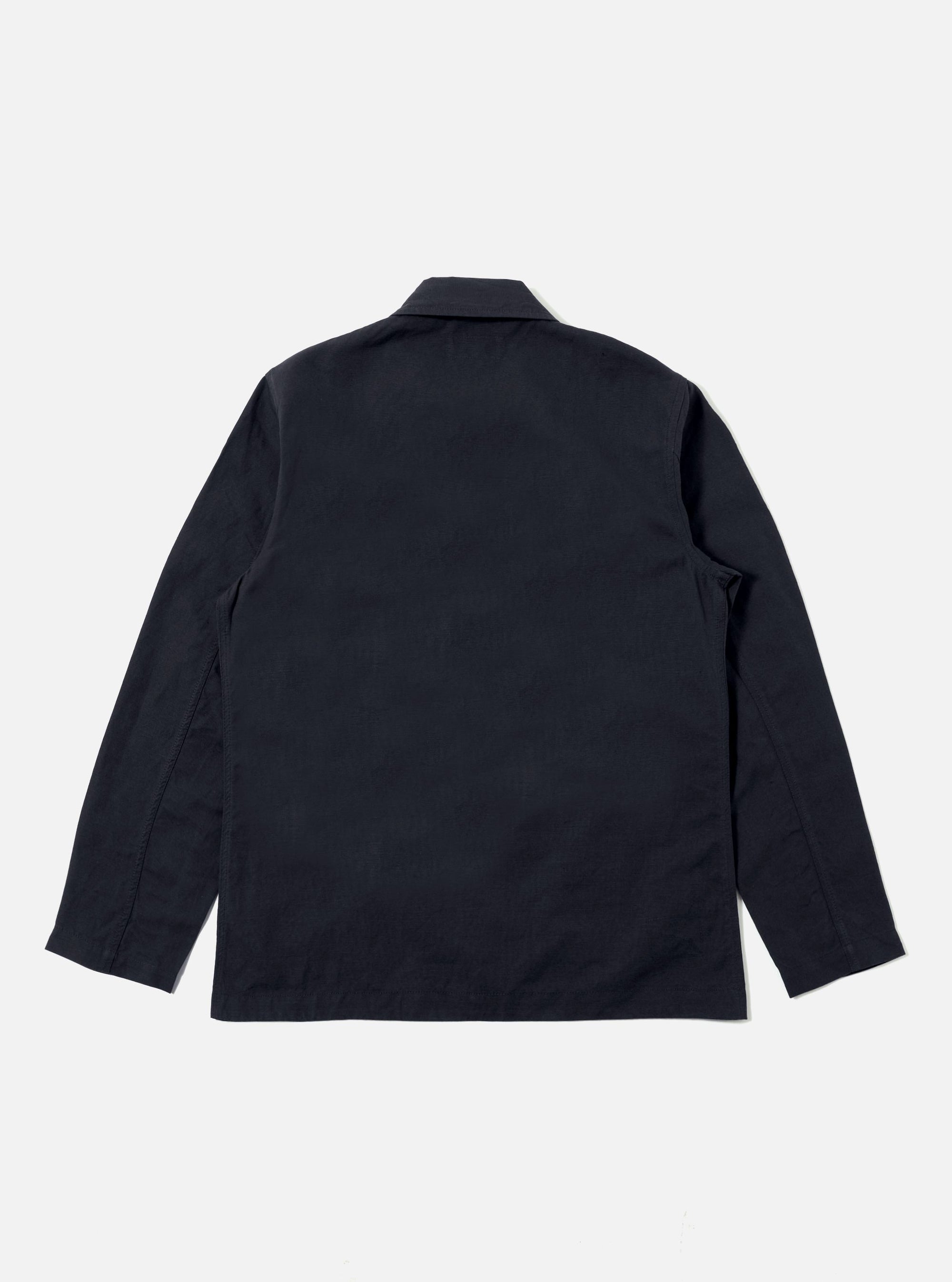 The back of a Navy Linen Slub Weave Bakers Jacket on a white background. The jacket is a dark navy color and has a relaxed fit.