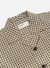Close-up of the Olive Dobby Check Cancun Jacket on a white background. The jacket has an olive, white, and orange check pattern and dark buttons.