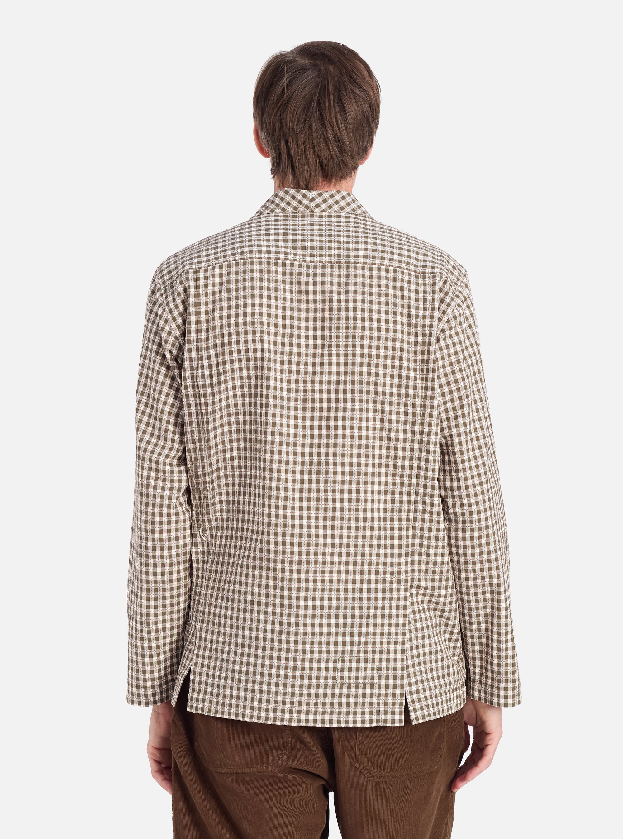 Back view of a model wearing the Olive Dobby Check Cancun Jacket. The jacket has a green and white check pattern. The background is a plain white studio backdrop.