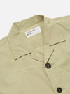 Close-up of the Pale Green Broadcloth Cancun Jacket on a white background. The broadcloth material has a soft, subtle texture. Features a camp collar and button closure.