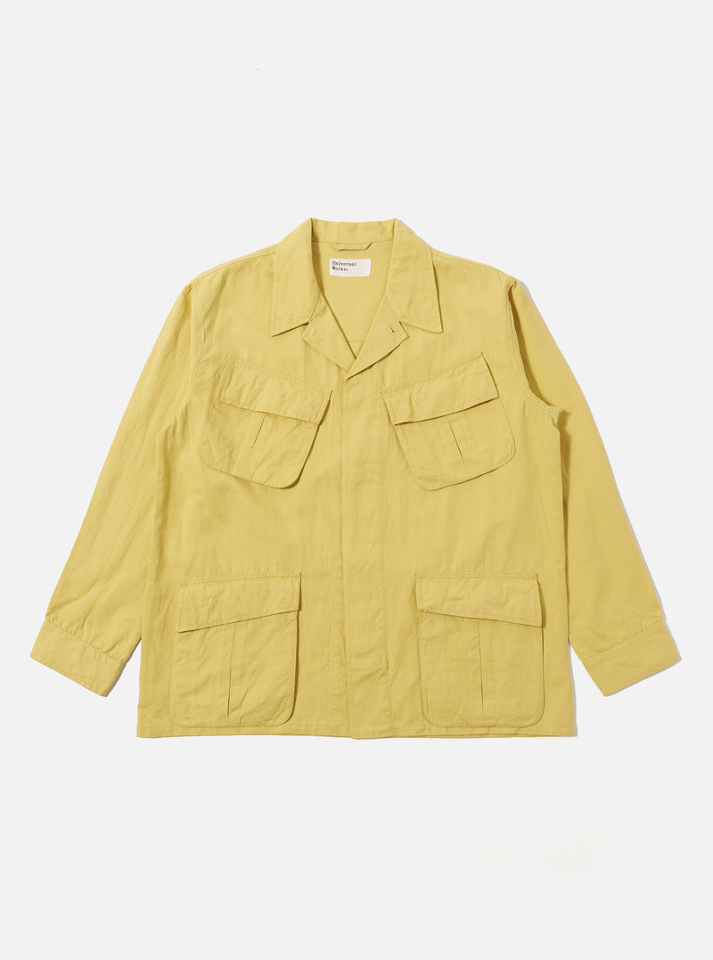 Flat lay of a Lemon Linen Slub Weave Jungle Jacket on a white background. The jacket is lemon-colored with a linen texture and features four front pockets.