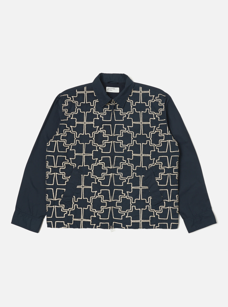 The Navy Mitla Broadcloth Club Jacket on a white background. The jacket is navy with a white geometric pattern on the front. The sleeves are plain navy.