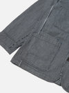 Close-up of the Indigo Hickory Stripe Denim Original Bakers Jacket on a white background, showing the striped pattern and pocket detail.