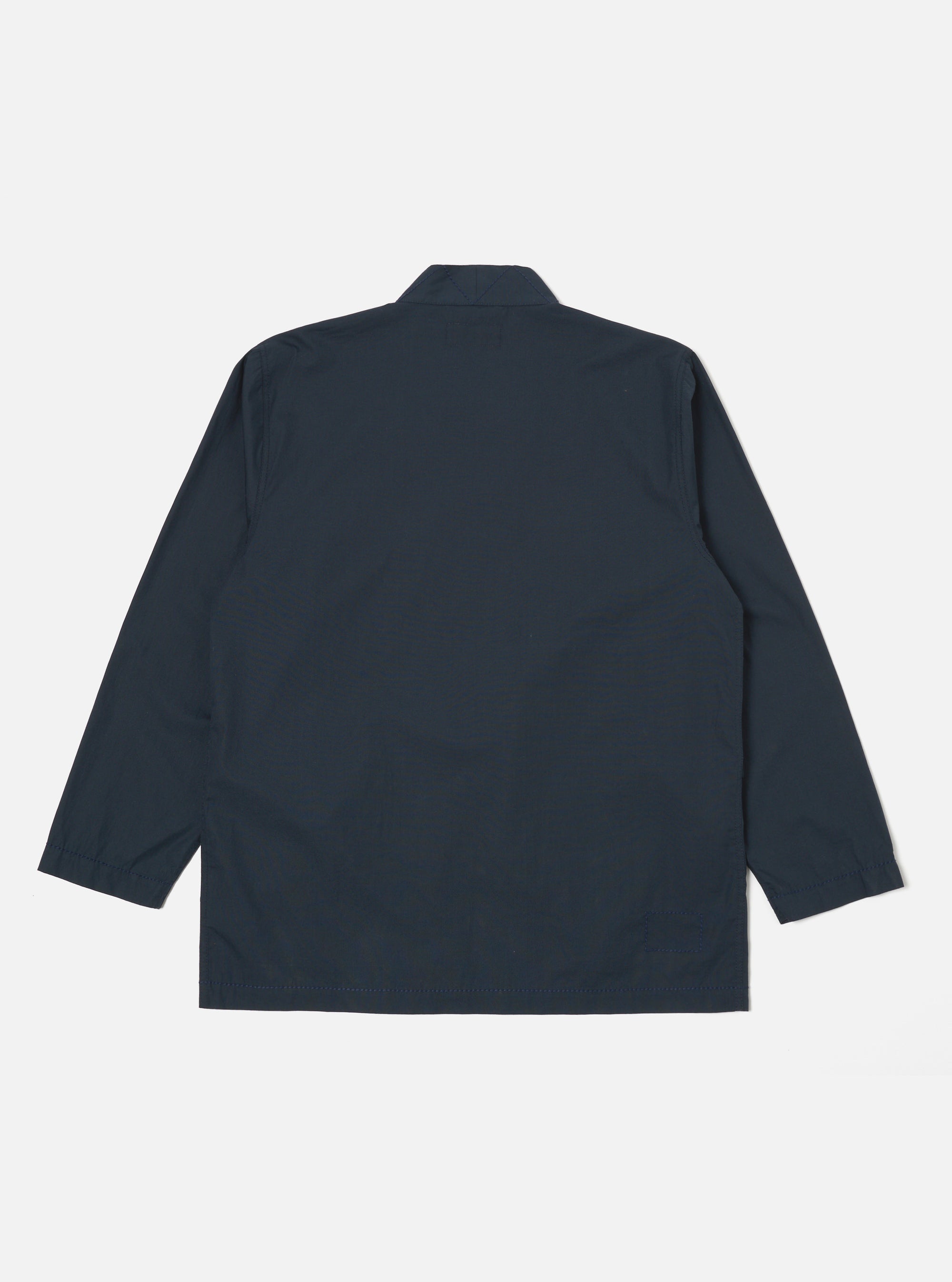 The back of a Navy Broadcloth Osaka Work Jacket in navy broadcloth on a white background. The jacket has a relaxed fit and long sleeves.