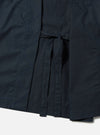 Close-up of the navy broadcloth Osaka Work Jacket, featuring a tie closure and detailed stitching. The jacket is displayed on a white surface.