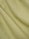 Close-up of the pale green broadcloth Osaka work jacket fabric. The material is draped to show texture and color.