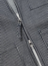 Close-up of the Indigo Hickory Stripe Denim Marine Gilet, showcasing the blue and white striped denim fabric and silver zipper. The image is shot on a flat, neutral surface.