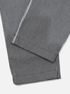 Close-up of the Indigo Hickory Stripe Denim Duke Pant. The denim material features vertical indigo and white stripes. The pants are neatly folded on a white surface.