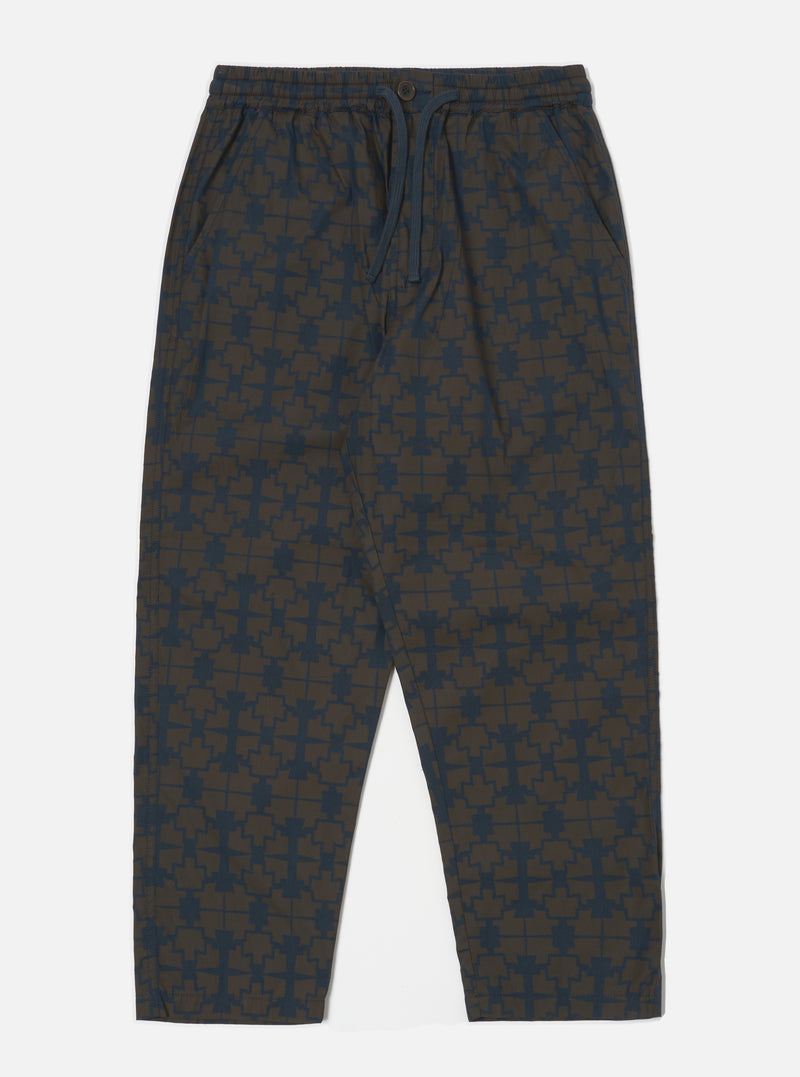 The Navy Mitla Print Cotton Hi Water Trouser on a white background. These stylish trousers feature a navy and brown geometric print and a comfortable, relaxed fit.