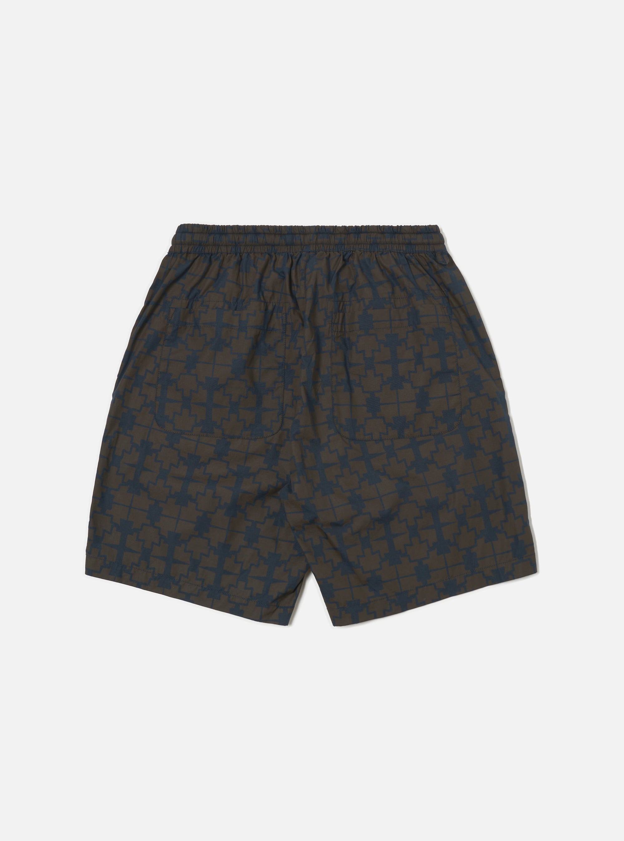 Back view of Navy Mitla Print Cotton Simple Short on a white background. The shorts are brown with a navy geometric print and have a relaxed fit.