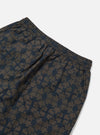Close-up of the Navy Mitla Print Cotton Simple Short, showcasing the navy pattern on cotton. Elastic waist and back pocket visible. Shot on a white background.