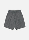 The Indigo Hickory Stripe Denim Pleated Track Short is displayed on a white background. The shorts are pleated and made of denim with indigo and white stripes.