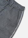 Close-up of Indigo Hickory Stripe Denim Pleated Track Short. Shows the striped denim material and pleated waist on a white background.